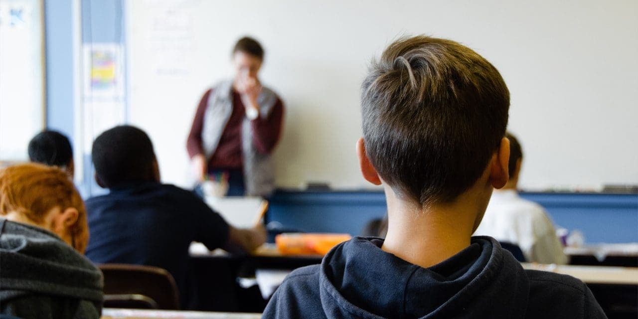 closeup of back's child inside a classroom