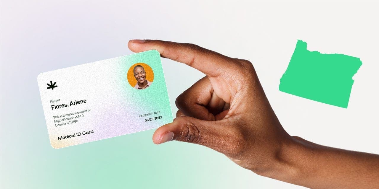 closeup hand holding MMJ card